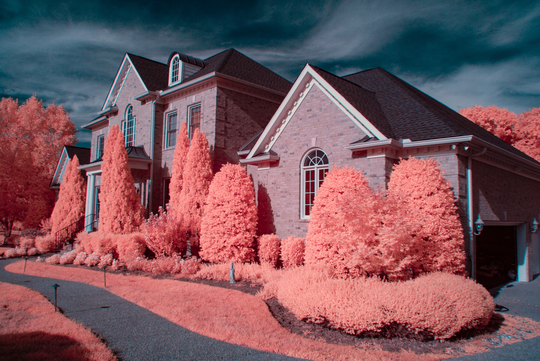 Brick home surrounded by vivid pink false-color infrared foliage in SummerHill, Franklin, Tennessee — Nikon D200, 590nm, 18-140mm DX kit lens